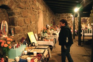 Becca DeLap of Flagstaff Nuestras Raíces looks over some of the ofrendas / altars during the museum member-only opening in 2012. Photos / Fotos: Frank X. Moraga / AmigosNAZ