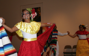 Ballet Folklorico de Colores — Flagstaff, above, will be making a return appearance at the 10th anniversary of Celebraciones de la Gente on Oct. 26-27 at the Museum of Northern Arizona. Those gathered for a group photo, below, include members of Flagstaff Nuestras Raíces, Mariachi Sol Azteca and Mayan members from the Asociación Cultural Gran Señor Tepepul-Chutnamit from Guatemala.