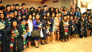 Students gather for a group photo during the 2014 Hispanic Convocation at Northern Arizona University. While Hispanic K-12 students have been making gains in the classroom in recent years, summer has become a crucial time for students to maintain their educational achievements as they prepare for community college and university admission. AmigosNAZ file photo ©2015