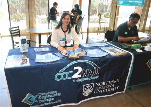 CCC2NAU Academic Adviser Jessica Laessig prepares to answer questions from young people during the annual Teen Job Fair held on the campus of Lone Tree on April 11, 2014.