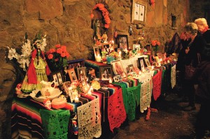 Visitors admire one of the more than two dozen ofrendas / altars in the historic Jaime Golightly courtyard at the Museum of Northern Arizona during the 2013 Celebraciones de la Gente. Photo by Frank X. Moraga / AmigosNAZ ©2014  