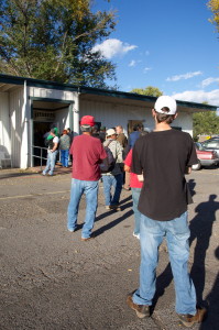 Clients of the Flagstaff Family Food Center: Kitchen and Food Bank, patiently wait in line for a hot meal at the center on Second Street. While volunteers and food donations typically increase during the holiday season, organizers say it’s just as important for the community to provide support for the center throughout the entire year. Photos by Star Hunter / AmigosNAZ ©2014