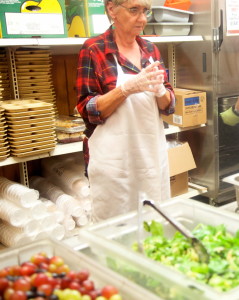 Gaye Knight prepares to serve the hot meal to customers that is provided from 4 to 5:30 p.m. daily.
