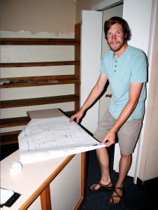 Patrick Pfeifer displays the architectural drawings for the indoor El Mercado de los Suenños / Marketplace of Dreams that is occupying a former dental office near the corner of Fourth and Seventh streets in the Cal-Ranch parking lot in Flagstaff. Photo by Frank X. Moraga / AmigosNAZ ©2014